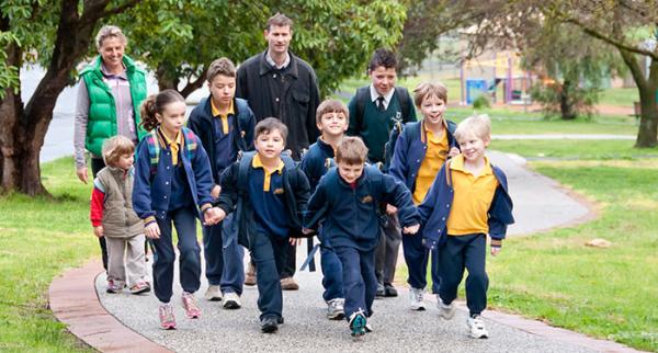 a group of children walking to doncaster primary school