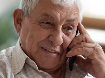 Senior man on phone smiling